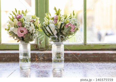 Wedding flower bouquets decorating old green window sill Wedding flower bouquets decorating old green window sill 140375559