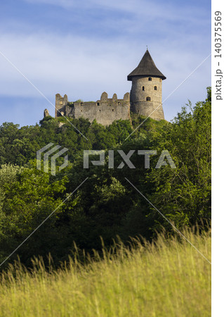 Salgotarjan Castle ruins towering over green landscape Salgotarjan Castle ruins towering over green landscape 140375569