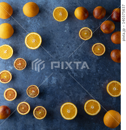 Fresh citrus fruits and blood oranges on blue background Fresh citrus fruits and blood oranges on blue background 140375637