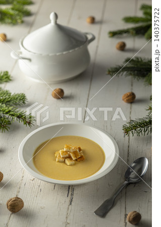 Creamy pumpkin soup with croutons for holiday dinner 140375722