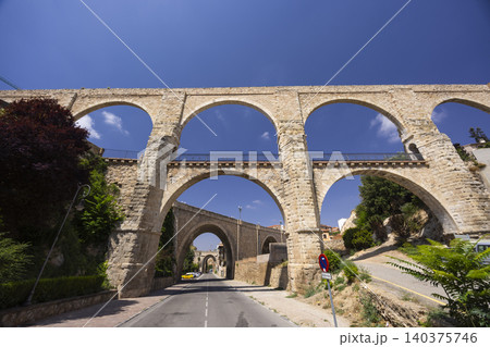 LOS ARCOS aqueduct in Teruel, Spain, with multiple stone arches LOS ARCOS aqueduct in Teruel, Spain, with multiple stone arches 140375746