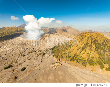 Amazing Mount Bromo volcano during sunrise from king kong viewpoint on Mountain Penanjakan in Bromo Tengger Semeru National Park,East Java,Indonesia.Nature landscape background Amazing Mount Bromo volcano during sunrise from king kong viewpoint on Mountain Penanjakan in Bromo Tengger Semeru National Park,East Java,Indonesia.Nature landscape background 140376745