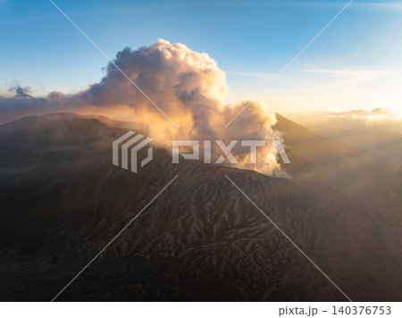 Amazing Mount Bromo volcano during sunrise from king kong viewpoint on Mountain Penanjakan in Bromo Tengger Semeru National Park,East Java,Indonesia.Nature landscape background Amazing Mount Bromo volcano during sunrise from king kong viewpoint on Mountain Penanjakan in Bromo Tengger Semeru National Park,East Java,Indonesia.Nature landscape background 140376753