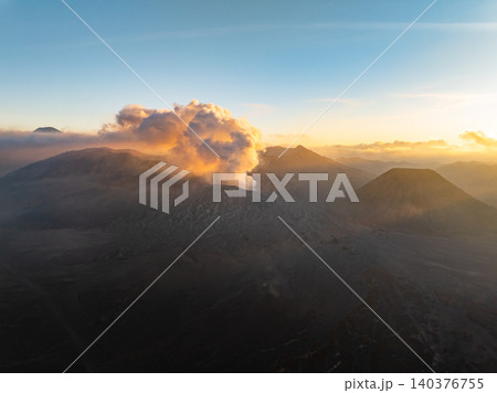 Amazing Mount Bromo volcano during sunrise from king kong viewpoint on Mountain Penanjakan in Bromo Tengger Semeru National Park,East Java,Indonesia.Nature landscape background Amazing Mount Bromo volcano during sunrise from king kong viewpoint on Mountain Penanjakan in Bromo Tengger Semeru National Park,East Java,Indonesia.Nature landscape background 140376755