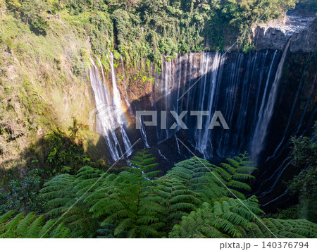 Aerial view of the Tumpak Sewu Waterfalls also known as Coban Sewu.Beautiful Tumpak Sewu Waterfalls are a tourist attraction in East Java, Indonesia.Amazing travel destination in asia 140376794