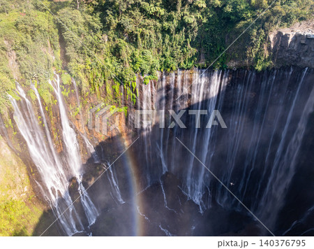 Aerial view of the Tumpak Sewu Waterfalls also known as Coban Sewu.Beautiful Tumpak Sewu Waterfalls are a tourist attraction in East Java, Indonesia.Amazing travel destination in asia Aerial view of the Tumpak Sewu Waterfalls also known as Coban Sewu.Beautiful Tumpak Sewu Waterfalls are a tourist attraction in East Java, Indonesia.Amazing travel destination in asia 140376795