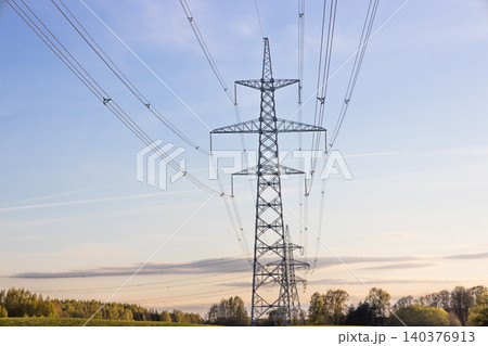 High voltage power lines and transmission tower High voltage power lines and transmission tower 140376913