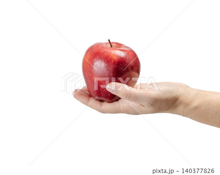 Red ripe apple on the woman's palm with the white background. 140377826