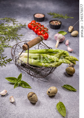 Fresh asparagus spears in basket with various ingredients Fresh asparagus spears in basket with various ingredients 140378077