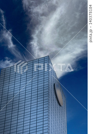 A modern glass office tower with a copy space for a corporate logo A modern glass office tower with a copy space for a corporate logo 140378184