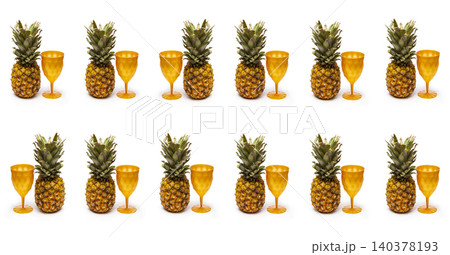 Glasses and ripe pineapples on a white background 140378193