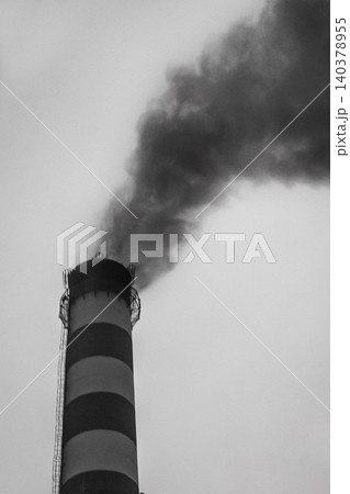 Pollution of the environment, air and ecology are global problems. Toxic smoke from the dirty chimney of an industrial plant is released into the atmosphere 140378955