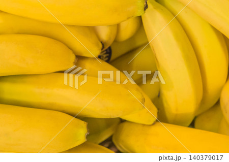 Bunch yellow ripe fresh fruit organic banana background bright vibrant tropical food 140379017