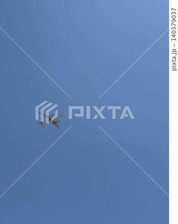 Small Airplane Silhouette Flying Against Vast Clear Blue Sky Minimal Photo Small Airplane Silhouette Flying Against Vast Clear Blue Sky Minimal Photo 140379037