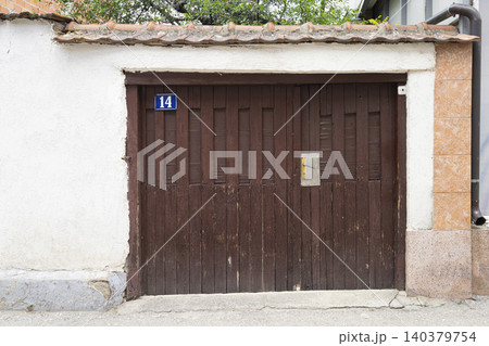 An old locked double door An old locked double door 140379754