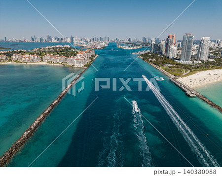 Aerial view of boats on turquoise waters in Miami. Yacht retreat in Miami. Aerial view of boats on turquoise waters in Miami. Yacht retreat in Miami. 140380088