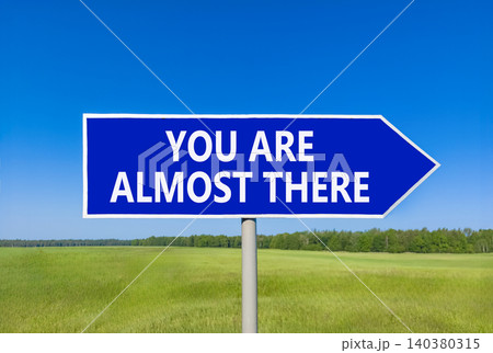 You are almost there symbol. Concept words You are almost there on beautiful blue road sign. Beautiful blue sky background. Business You are almost there motivational support concept. Copy space You are almost there symbol. Concept words You are almost there on beautiful blue road sign. Beautiful blue sky background. Business You are almost there motivational support concept. Copy space 140380315