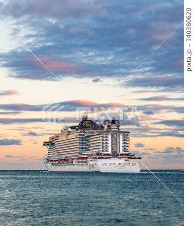 Miami, Florida, USA - December 23, 2024: Cruise in summer vacation. MSC cruises cruise line. Cruise ship tour and travel at sea. Illuminated ship in evening. MSC Seaside cruise ship voyage 140380620
