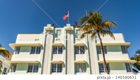 Miami Beach in Ocean Drive Florida. Art Deco building architecture. Architectural building. Art deco. Architectural district Art Deco. Modern building of Miami beach with American flag. Ocean drive 140380631