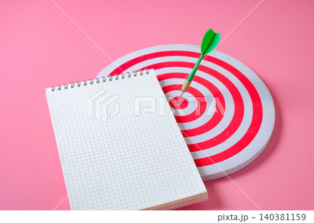 Book note on red dartboard with arrow .Business target. Book note on red dartboard with arrow .Business target. 140381159