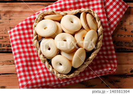 Authentic Brazilian Cassava Cookies Served in Bowl on Red Checkered Cloth, Rustic Table 140381304