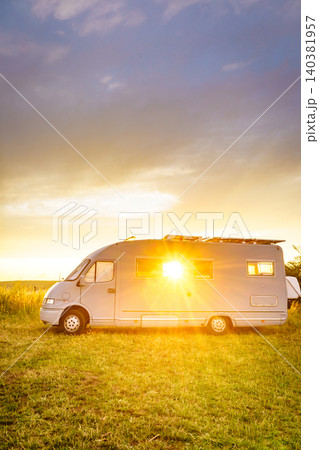 Sunset sky over caravan camping on nature. Summer trip. Sunset sky over caravan camping on nature. Summer trip. 140381957