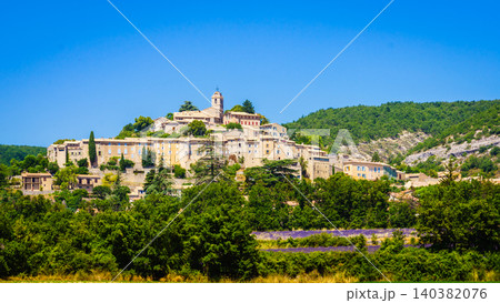 Summer view with Provence hilltop Banon village. Alpes-de-Haute-Provence in France Summer view with Provence hilltop Banon village. Alpes-de-Haute-Provence in France 140382076