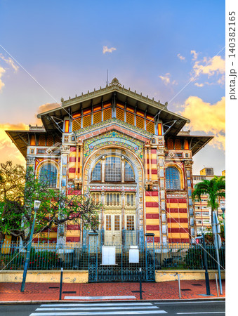 The vibrant facade of the Schoelcher Library at sunset in Fort-de-France, Martinique, showcasing its unique eclectic architecture and colorful details. The vibrant facade of the Schoelcher Library at sunset in Fort-de-France, Martinique, showcasing its unique eclectic architecture and colorful details. 140382165
