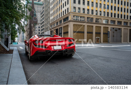 New york, usa august 22,2024. Red ferrari supercar parked on an empty manhattan street, epitomizing luxury, power and sleek urban lifestyle in new york 140383134