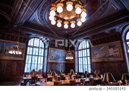 New york, usa august 22,2024. Ornate rose reading room interior with grand arched windows, chandeliers, dark wood paneling and elegant historic library atmosphere New york, usa august 22,2024. Ornate rose reading room interior with grand arched windows, chandeliers, dark wood paneling and elegant historic library atmosphere 140383143