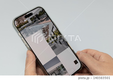 Browsing premium real estate listings online Browsing premium real estate listings online 140383501