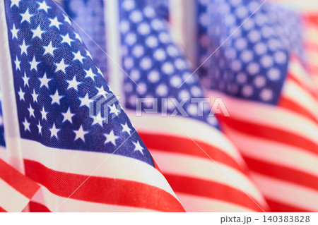 Waving american flags symbolizing patriotism and independence day Waving american flags symbolizing patriotism and independence day 140383828