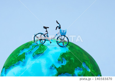 World bicycle day. Bicycle sharing model on globe representing sustainable transport World bicycle day. Bicycle sharing model on globe representing sustainable transport 140383870