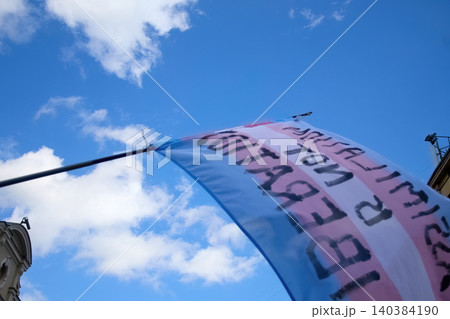 Transgender flag waving for liberation against blue sky Transgender flag waving for liberation against blue sky 140384190