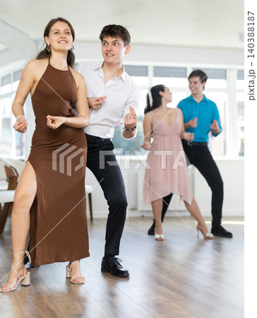 Couple young woman and man dancing twist Couple young woman and man dancing twist 140388187
