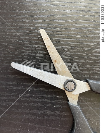 Open Rusted Utility Scissors On Dark Wood Table Open Rusted Utility Scissors On Dark Wood Table 140389035
