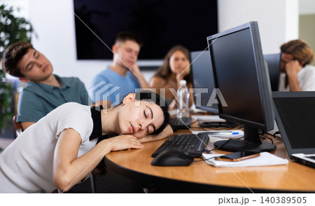 Exhausted students find solace in sleep Exhausted students find solace in sleep 140389505