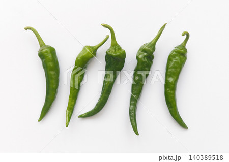 Green Chili Peppers Isolated on White Background Green Chili Peppers Isolated on White Background 140389518
