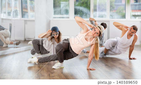 Young girl practicing breakdance floor-works in training hall 140389650