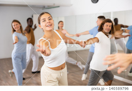Adult couples dancing active dance together in studio 140389796