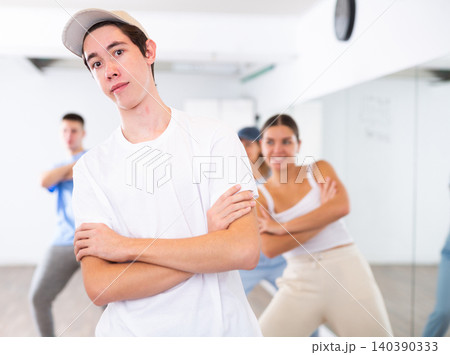 Young guy learning dance in dance studio Young guy learning dance in dance studio 140390333