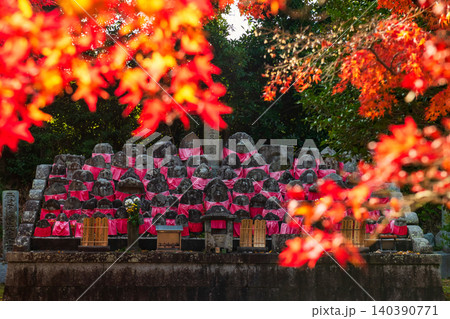 Buddha statue at graveyard by fall red maple leaf, Shinnyodo, Kyoto Buddha statue at graveyard by fall red maple leaf, Shinnyodo, Kyoto 140390771
