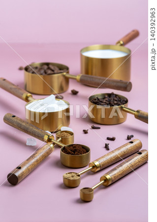 Coffee Brewing Ingredients in Measuring Cups. Coffee Brewing Ingredients in Measuring Cups. 140392963