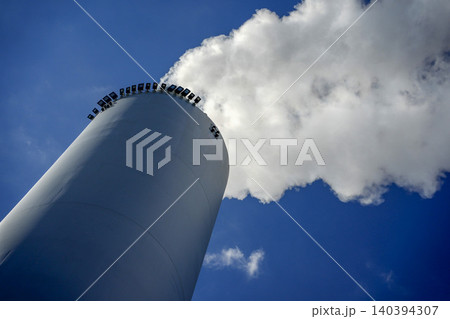 detail of chimney with smoke of CopenHill innovative waste to energy power plant in Copenhagen It perfectly merges urban recreation with green energy detail of chimney with smoke of CopenHill innovative waste to energy power plant in Copenhagen It perfectly merges urban recreation with green energy 140394307