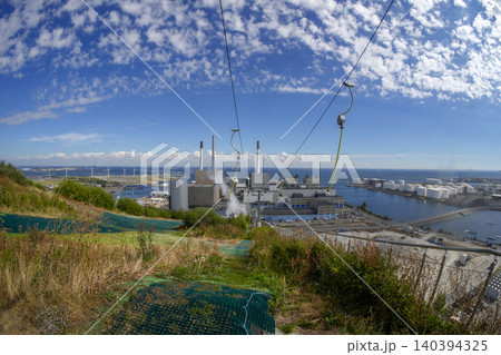 CopenHill innovative waste-to-energy power plant in Copenhagen that features a functioning artificial ski slope, hiking trails, and the world's tallest climbing wall on its roof 140394325