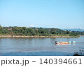 Beautiful Traditional boat  in Mekong river forms the border between Thailand and Laos with blue sky. 140394661