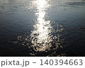 Beautiful light sparkling and shiny sunset in water sea surface 140394663