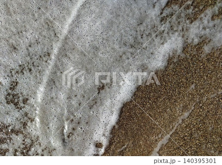 Sea foam on the seashore Sea foam on the seashore 140395301