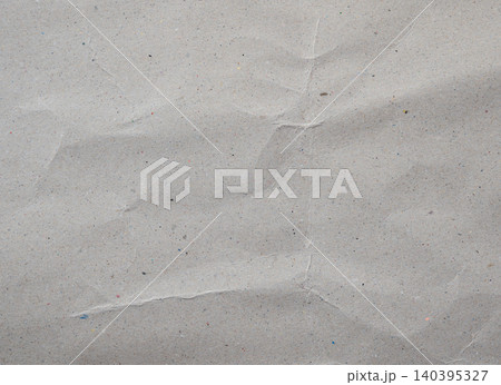 Crumpled recycled cardboard paper texture background Crumpled recycled cardboard paper texture background 140395327