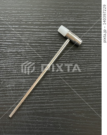 Small Dual-Head Nylon Hammer On Black Wood Background Small Dual-Head Nylon Hammer On Black Wood Background 140397229